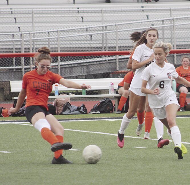 Emily Geer clears the ball.
